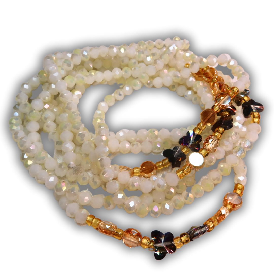 cream white waist beads with gold accents and dark butterflies
waist beads handmade in ghana 